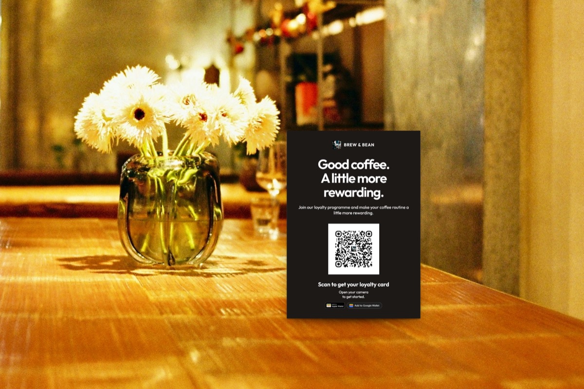 Illustration: an A6 loyalty card with a QR code standing on a café table, made with the FaveCard print editor