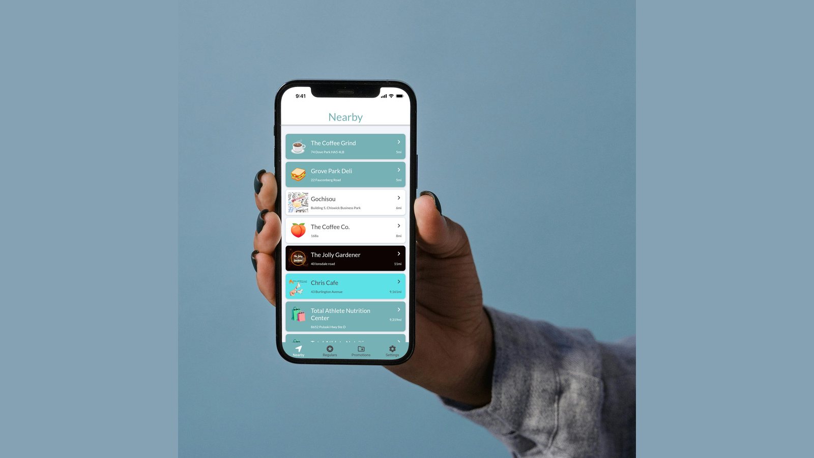 The Loyalzoo customer app on a phone, showing its Nearby screen listing local businesses where customers can collect loyalty.