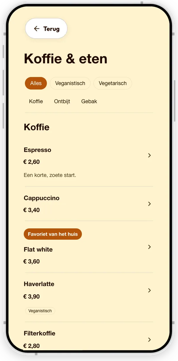 Menukaart van een koffiebar (voorbeeld): koffie met prijzen, een Vegan-label en de badge ‘Favoriet van het huis’.